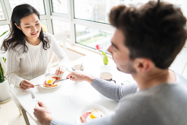 istock Couple having delicious breakfast together in apartment 1146695916