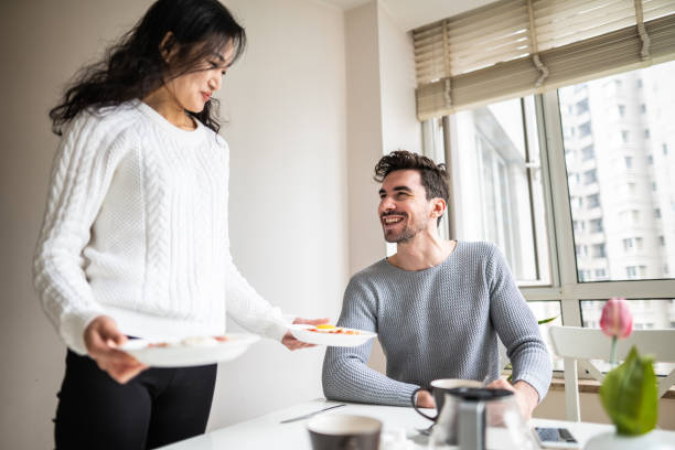 istock Woman serving breakfast at home 1146695956