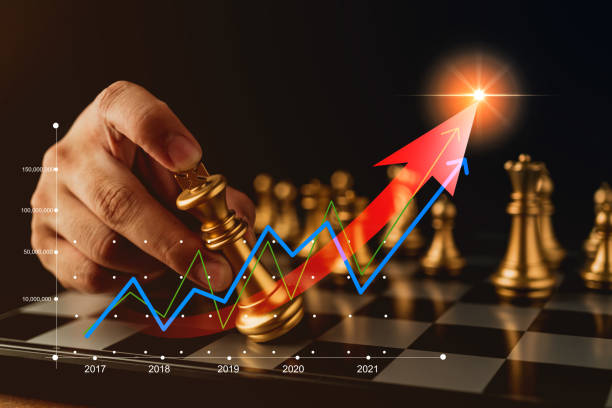 istock business strategy brainstorm chess board game with hand control financial graph chart growth on black background with free copy space for your text 1146698217