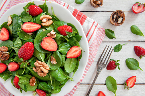 Spinach salad on a rustic background