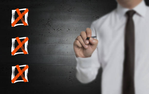istock Checklist is written by businessman on screen 1146700638