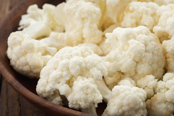 istock cauliflower on wood plate on wood 1146701782