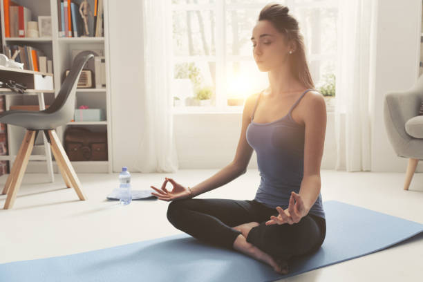 istock Young confident woman practicing mindfulness meditation at home 1146701869