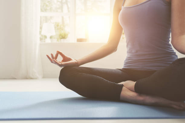 istock Young confident woman practicing mindfulness meditation at home 1146701875