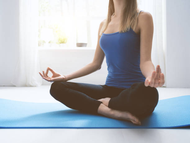 istock Young confident woman practicing mindfulness meditation at home 1146702011