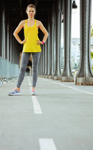 istock woman on Pont de Bir-Hakeim bridge relaxing after workout 1146703323