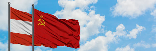 istock Austria and Soviet Union flag waving in the wind against white cloudy blue sky together. Diplomacy concept, international relations. 1146703644