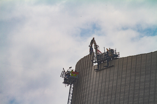the cooling tower of a nuclear power plant is demolished