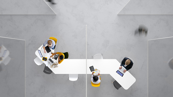 Overhead view of people working in a modern office