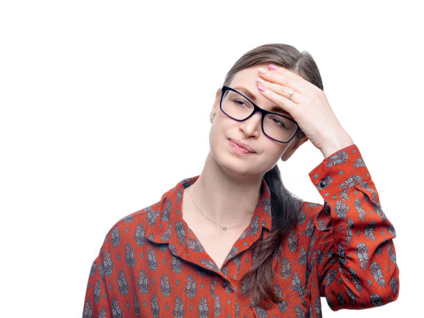 istock Young brunette woman with eyeglasses wearing red patterned blouse feeling headache. Negative suffering emotion on her face. Studio portrait isolated on white with high resolution 1146707022