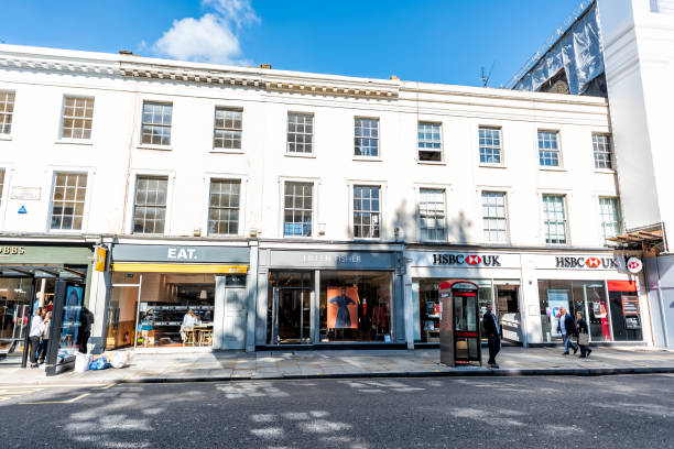 Neighborhood district of Chelsea with white architecture on King's road street London, UK - September 13, 2018: Neighborhood district of Chelsea with white architecture and shopping stores on King's road street high street stock pictures, royalty-free photos & images