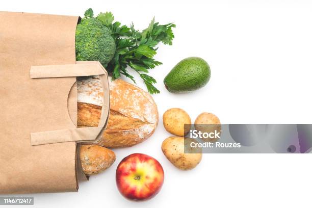 Full Paper Bag Of Different Health Food On White Stock Photo - Download Image Now - Supermarket, Bag, Paper Bag
