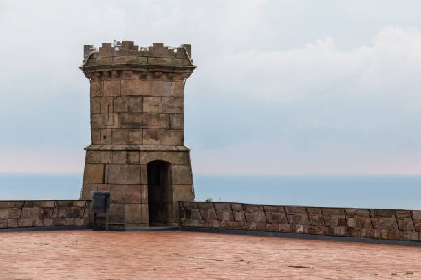 Barcelona, Catalonia, Spain - November 16, 2018: The tower of the Montjuic Castle on the upper area closeup in cloudy day