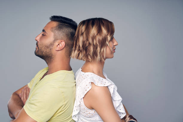 istock Close-up of Young couple standing back to back 1146716236
