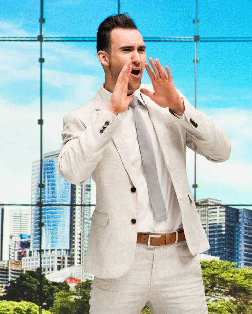 istock Handsome businessman standing at work and yelling 1146720328
