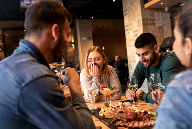 istock Group of young friends having fun in restaurant. 1146720455