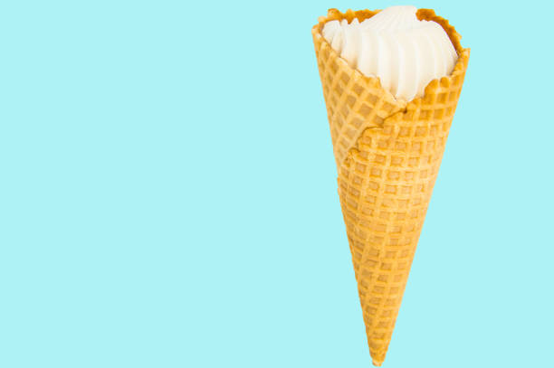 istock Ice cream cone vanilla on pastel blue background. Copy space 1146725333