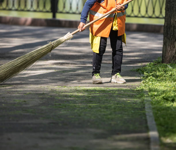 istock a worker with a broom sweeps the street 1146725417