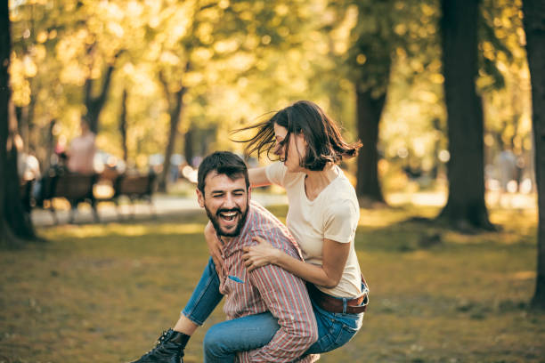 istock Young Couple is Enjoying Springtime in Park 1146725787