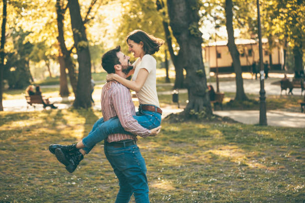 istock Young Couple is Enjoying Springtime in Park 1146725789
