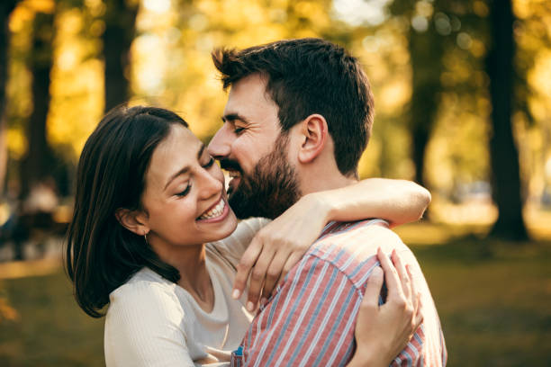istock Young Couple is Enjoying Springtime in Park 1146726752