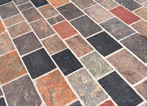 Multi-coloured paving stones viewed from an angle.