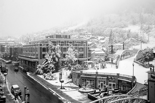 Park city,Utah USA - October 10, 2018 : Morning street shot of Park City Utah after an early Autumn snow storm blankets the city. Park City was a small mining town in 1800's . Now it is one of the best ski resort town in Utah. Also known for the Sundance Film Festival in every January. Bus trollies go up and down Main Street and provides free public transportation to everyone.