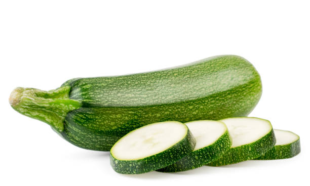 istock Fresh zucchini and sliced slices close up on a white. Isolated. 1146730858