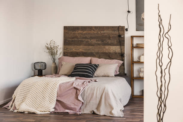 istock Black and white pillow on pastel pink and beige bedding 1146732592
