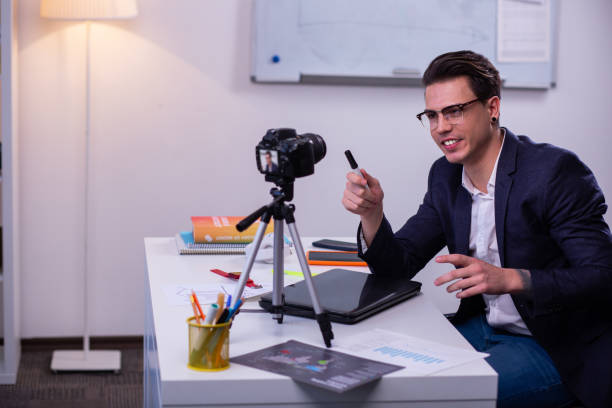 istock Involved short-haired guy in clear glasses wearing dark jacket 1146733943