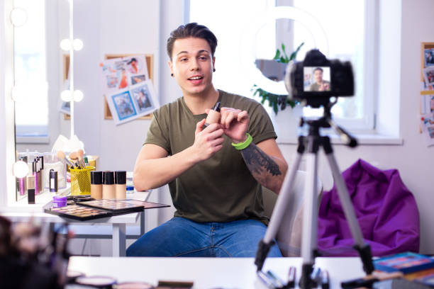 istock Positive expressive young blogger creating video about foundations 1146734071