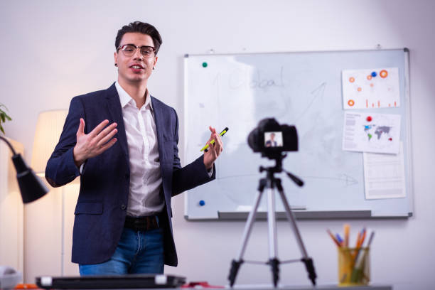 istock Expressive man in black neat jacket actively gesturing 1146735054