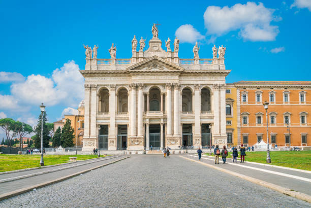 basilica of saint john lateran in rome on a sunny day, italy. - cloister imagens e fotografias de stock