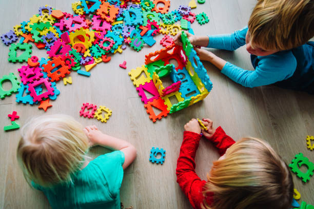 istock kids playing with number and shapes puzzle 1146739553