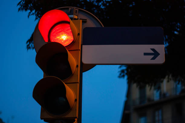 istock Traffic light on red with empty street sign for copy space 1146740835