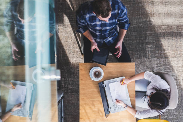 istock Overhead view of two coworkers 1146744589
