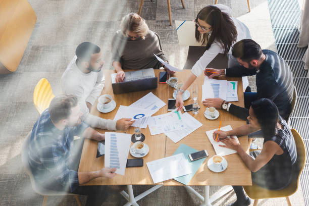 istock Overhead view of people working 1146745085