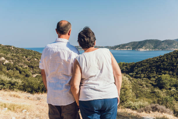 istock Senior couple at seaside viewpoint 1146746072