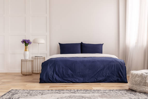 istock Simple navy blue and white bedroom interior design 1146746198