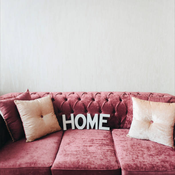istock Soft comfortable sofa. Hygge. Home. Pink sofa made of velor. 1146746318