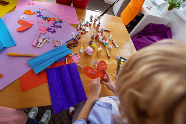 istock Blonde schoolboy making applied ornament at the lesson 1146747319