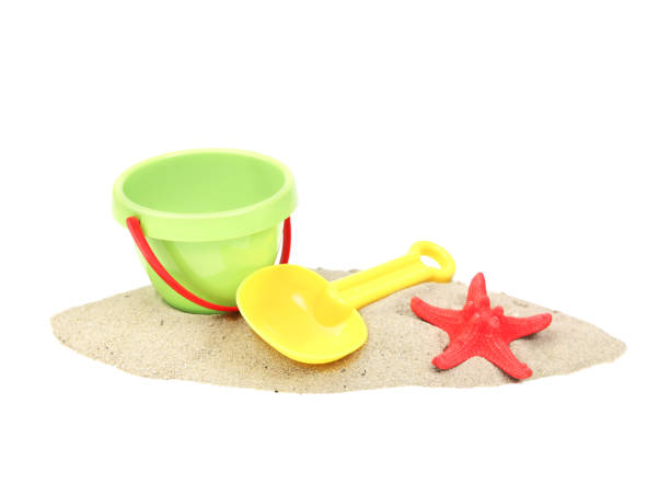 istock Plastic bucket and showel on sand isolated. 1146750711