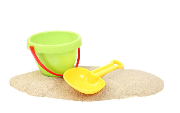 istock Plastic bucket and showel on sand isolated. 1146750716