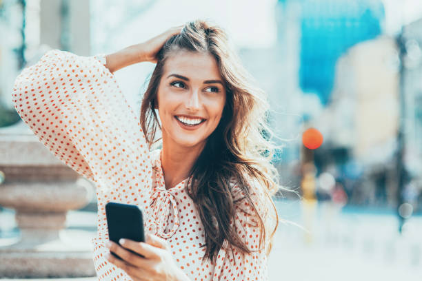 istock Happy woman using smart phone 1146751644