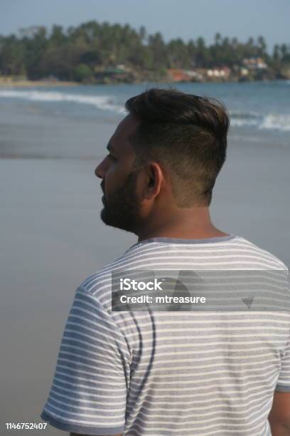 Image Of Hindu Indian Man On Seaside Holiday With Suntan Walking By Tropical Beach Sea At Image Of Hindu Indian Man On Seaside Holiday With Suntan Walking By Tropical Beach Sea At