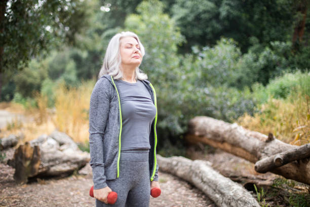istock Senior Woman Breathes Calmly During Workout 1146753748