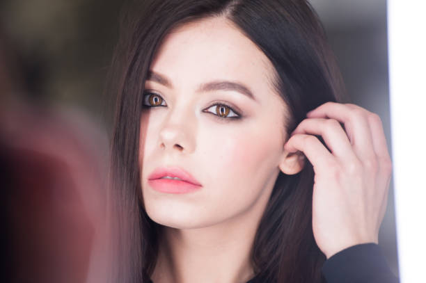istock Make up process of beautiful young woman 1146753755