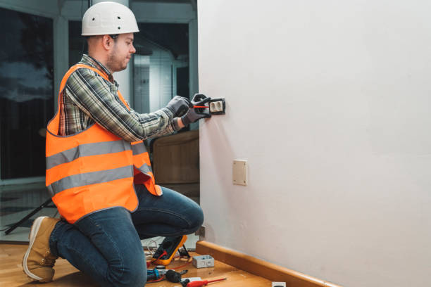 istock A young electrician setting up plug sockets in a house 1146755771