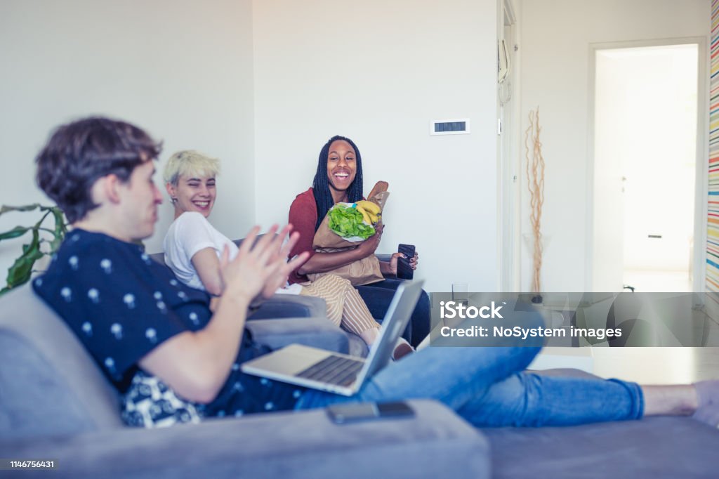 Generation Z roommates, sharing living and resources Young roommates in their daily activities 20-24 Years Stock Photo