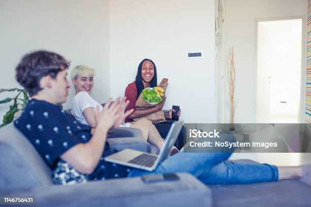 Generation Z Roommates Sharing Living And Resources Stock Photo - Download Image Now